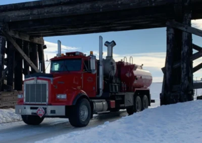 Hot oiler truck preparing for operation with hoses laid out